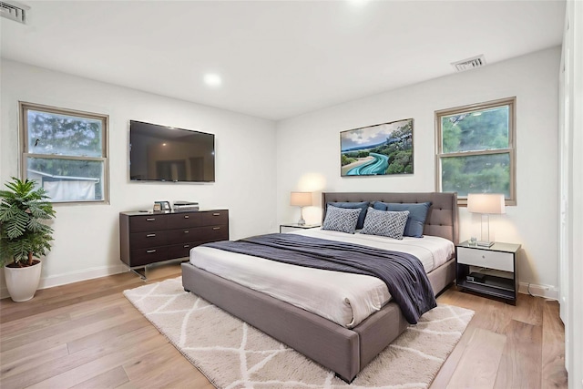 83 Scott Dr, Wappingers Falls, NY 12590 - bedroom featuring light wood-style floors, multiple windows, and recessed lighting