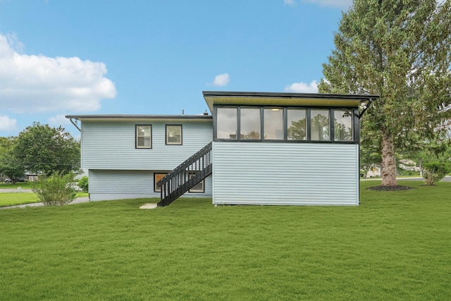 83 Scott Dr, Wappingers Falls, NY 12590 - rear view of property featuring stairs and a lawn