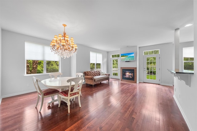 1 Country Club Dr, Middletown, NY 10940 - dining room featuring dark wood-style flooring, a chandelier, a tile fireplace, and baseboards
