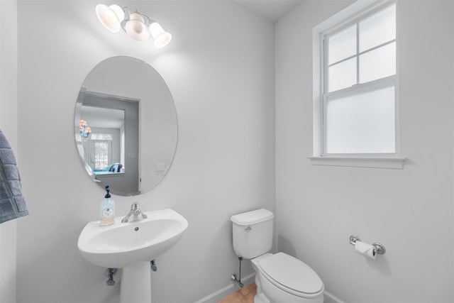 1 Country Club Dr, Middletown, NY 10940 - half bathroom featuring healthy amount of natural light, toilet, and baseboards