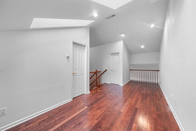 1 Country Club Dr, Middletown, NY 10940 - additional living space with a skylight, lofted ceiling, wood-type flooring, and baseboards