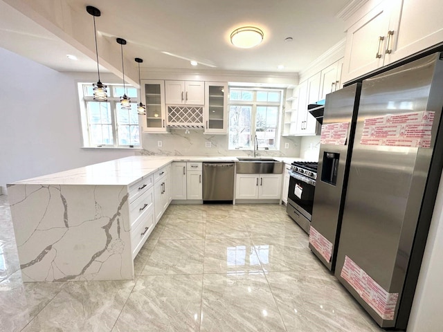 36-46 205th St, Bayside, NY 11361 - kitchen with stainless steel appliances, a peninsula, a sink, light marble finish flooring, and light stone counters