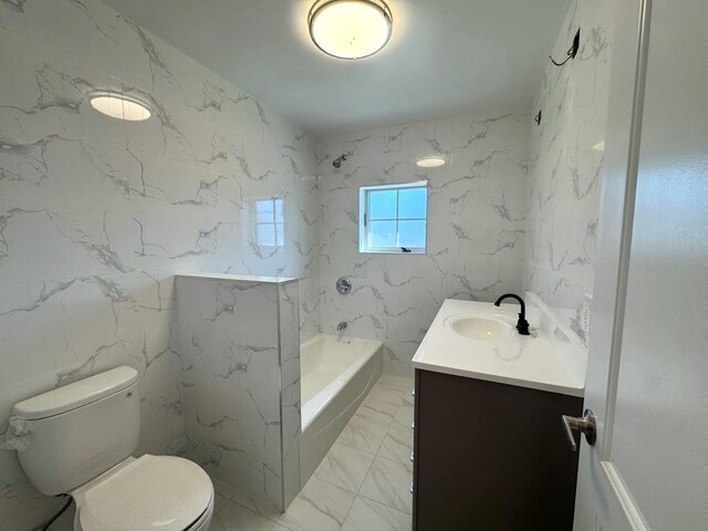 36-46 205th St, Bayside, NY 11361 - full bathroom featuring vanity, toilet, marble finish floors, and tile walls