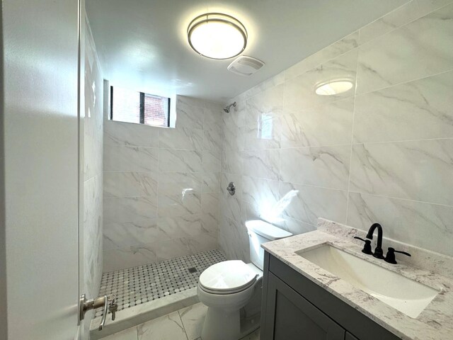 36-46 205th St, Bayside, NY 11361 - bathroom featuring a stall shower, vanity, toilet, and tile walls