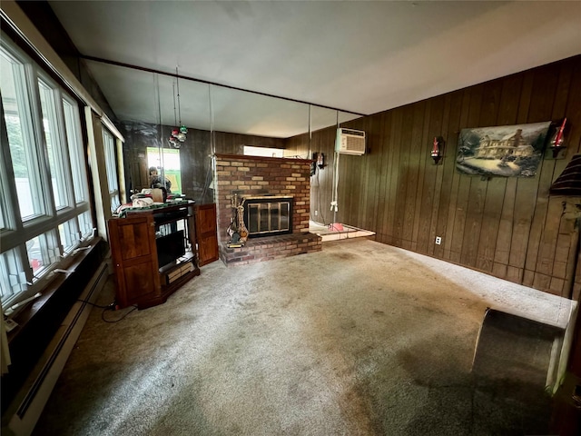 4 Susan Ct, Deer Park, NY 11729 - unfurnished living room featuring carpet, wood walls, a brick fireplace, a baseboard radiator, and a wall unit AC