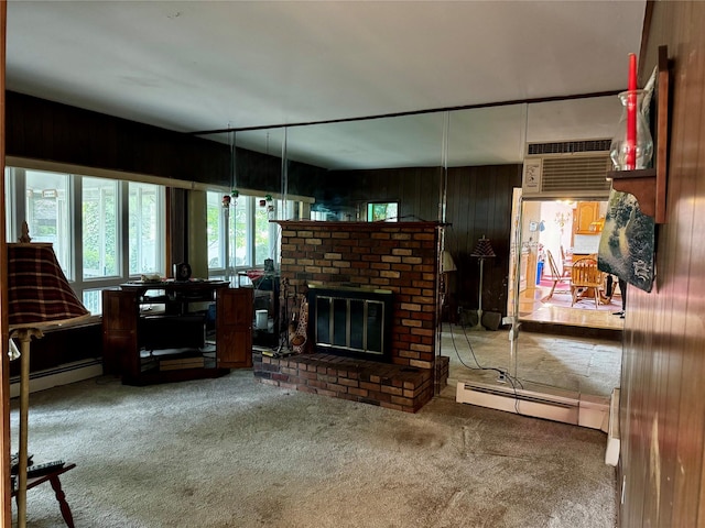 4 Susan Ct, Deer Park, NY 11729 - carpeted living area featuring a baseboard radiator, wood walls, a fireplace, and a wall mounted AC