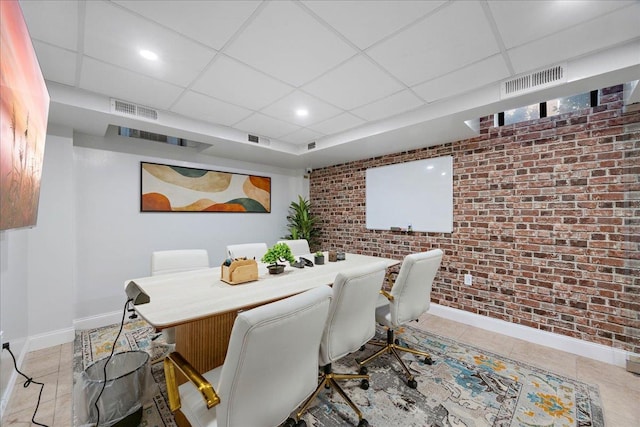 210 Pelham Rd Unit 6F, New Rochelle, NY 10805 - tiled dining space featuring brick wall, baseboards, a paneled ceiling, an accent wall, and recessed lighting
