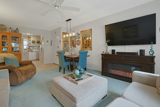 135-5 S Highland Ave Unit D4, Ossining, NY 10562 - living room with ceiling fan, carpet floors, and a glass covered fireplace