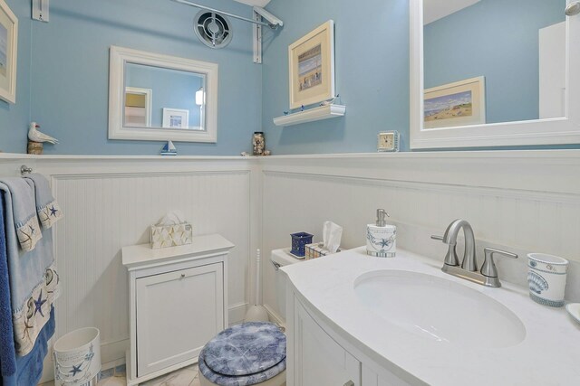 135-5 S Highland Ave Unit D4, Ossining, NY 10562 - bathroom featuring a wainscoted wall, vanity, and a decorative wall