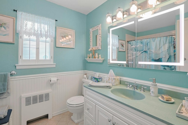 135-5 S Highland Ave Unit D4, Ossining, NY 10562 - full bath with radiator, toilet, a wainscoted wall, vanity, and tile patterned floors