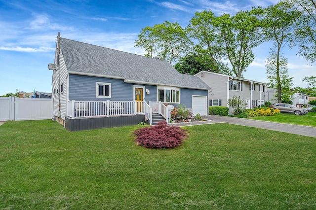 379 Columbus Ave, West Babylon, NY 11704 - view of front of home with driveway, roof with shingles, and a garage