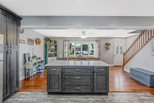 379 Columbus Ave, West Babylon, NY 11704 - kitchen with wood finished floors, light countertops, and baseboards