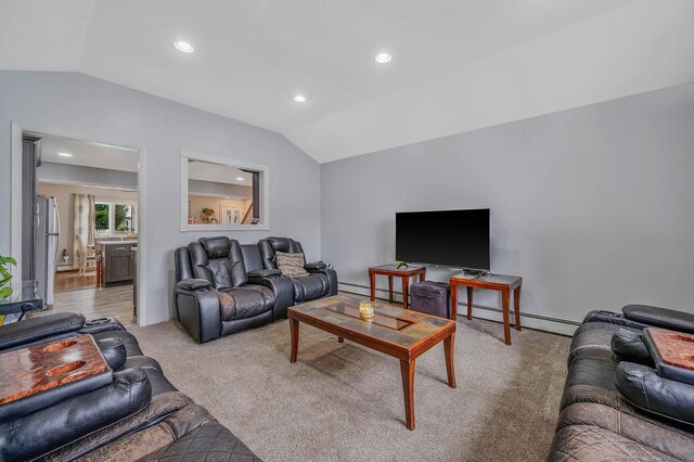 379 Columbus Ave, West Babylon, NY 11704 - living area with vaulted ceiling, a baseboard heating unit, light carpet, and recessed lighting