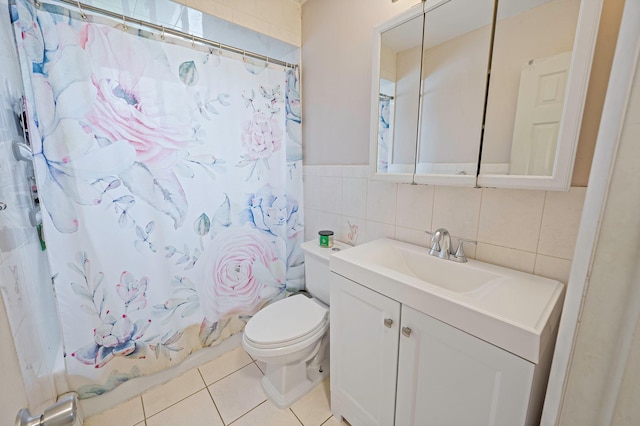379 Columbus Ave, West Babylon, NY 11704 - bathroom with toilet, vanity, tile walls, tile patterned flooring, and shower / bathtub combination with curtain