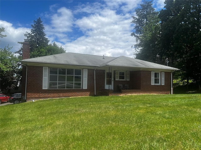 1 Hillside Ave, Haverstraw, NY 10927 - ranch-style home featuring a front lawn, a chimney, and brick siding