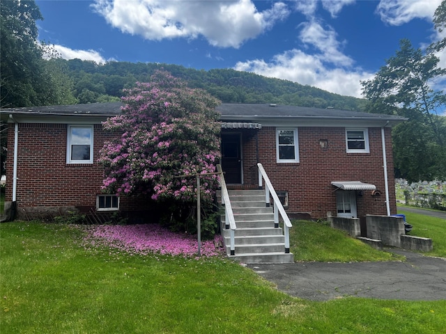 1 Hillside Ave, Haverstraw, NY 10927 - view of front of house featuring brick siding and a front yard