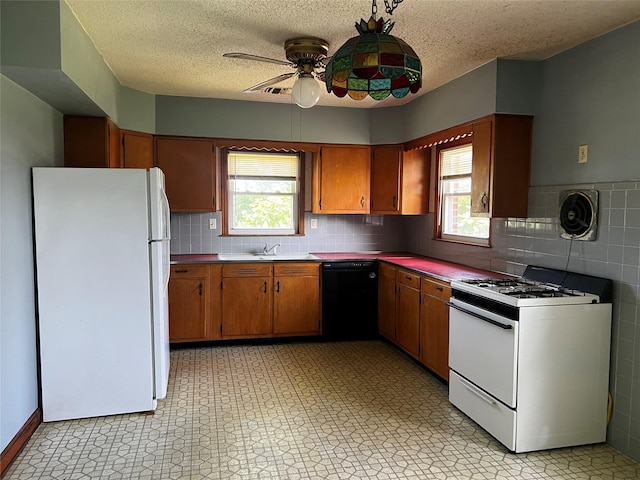 1 Hillside Ave, Haverstraw, NY 10927 - kitchen featuring white appliances, a ceiling fan, plenty of natural light, light flooring, and a textured ceiling