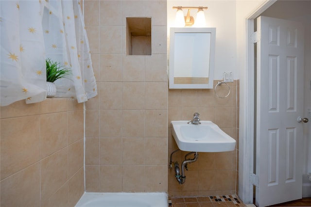 3496 Fort Independence St, Bronx, NY 10463 - bathroom featuring a sink and tile walls