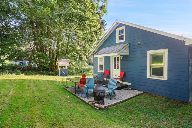 6 Gardner Hollow Rd, Poughquag, NY 12570 - back of house featuring a yard, a storage shed, a fire pit, and a patio