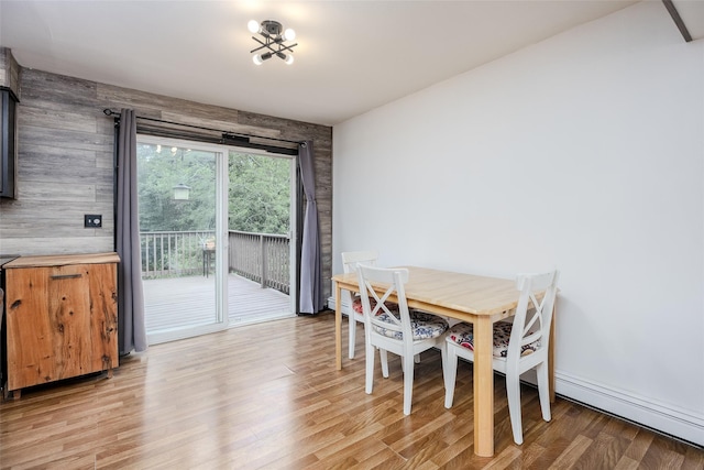 112 Middle Island Blvd, Middle Island, NY 11953 - dining room with light wood-style floors and a baseboard radiator