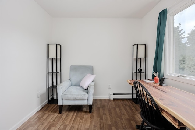 112 Middle Island Blvd, Middle Island, NY 11953 - sitting room featuring a baseboard heating unit, healthy amount of natural light, and wood finished floors