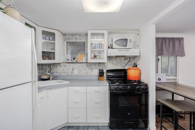 112 Middle Island Blvd, Middle Island, NY 11953 - kitchen with white appliances, premium range hood, backsplash, and light countertops