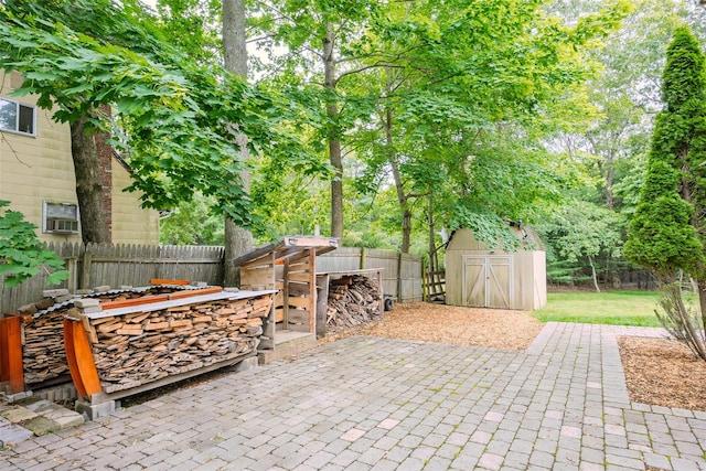 112 Middle Island Blvd, Middle Island, NY 11953 - fenced backyard with a storage unit and a patio