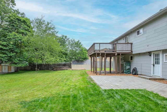 112 Middle Island Blvd, Middle Island, NY 11953 - fenced backyard with a storage unit, a wooden deck, and a patio area
