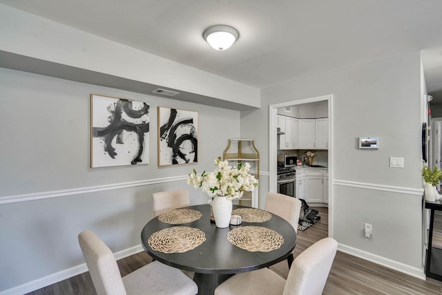 120 Fairview Cir Unit 120, Middle Island, NY 11953 - dining room with baseboards and wood finished floors