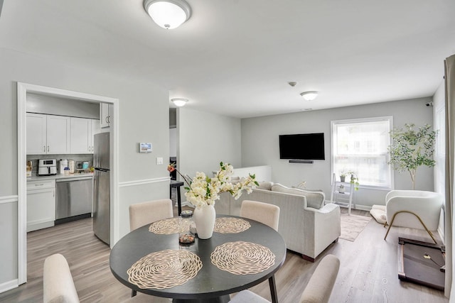 120 Fairview Cir Unit 120, Middle Island, NY 11953 - dining area featuring light wood-style flooring and baseboards