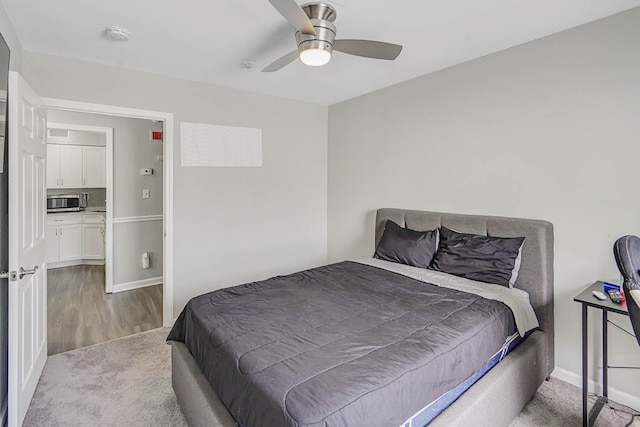 120 Fairview Cir Unit 120, Middle Island, NY 11953 - bedroom with baseboards, wood finished floors, and a ceiling fan