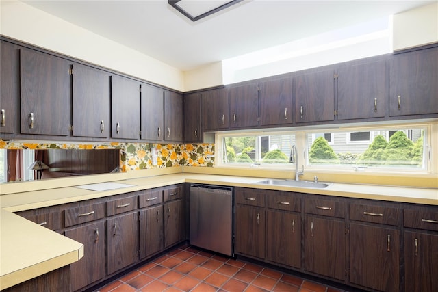 6 Bay View Dr, Hampton Bays, NY 11946 - kitchen featuring stainless steel dishwasher, a sink, dark tile patterned floors, light countertops, and dark brown cabinets