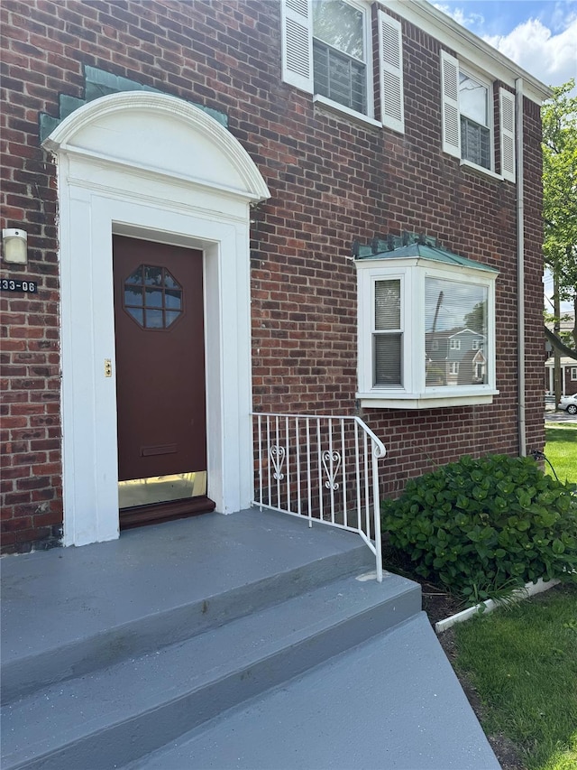 233-06 131st St Unit 1, Rosedale, NY 11412 - view of exterior entry featuring brick siding