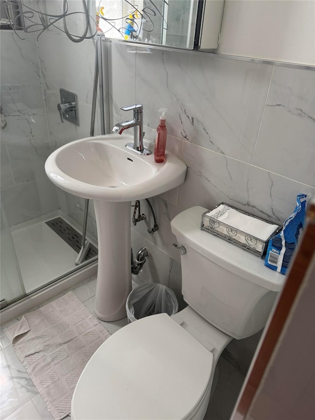 233-06 131st St Unit 1, Rosedale, NY 11412 - full bathroom featuring a stall shower, toilet, and tile walls