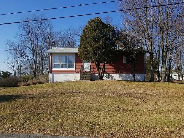 4 Maple Ln, Monroe, NY 10950 - view of front of property featuring a front lawn, a chimney, and entry steps