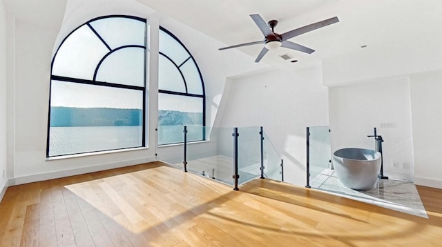 23 Water Grant St Unit 10D, Yonkers, NY 10701 - unfurnished bedroom featuring hardwood / wood-style floors, multiple windows, and baseboards