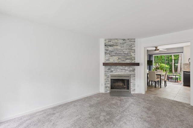 18 Taylor Commons, Yaphank, NY 11980 - living room featuring a stone fireplace, light colored carpet, and a ceiling fan
