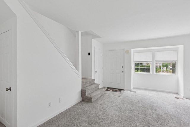 18 Taylor Commons, Yaphank, NY 11980 - entrance foyer featuring stairs, carpet, and baseboards