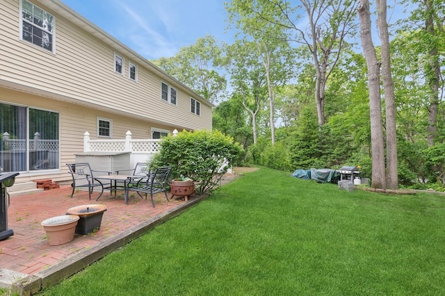 18 Taylor Commons, Yaphank, NY 11980 - view of grassy yard with a patio area
