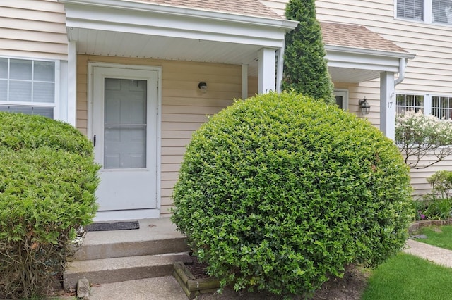 18 Taylor Commons, Yaphank, NY 11980 - entrance to property featuring a shingled roof