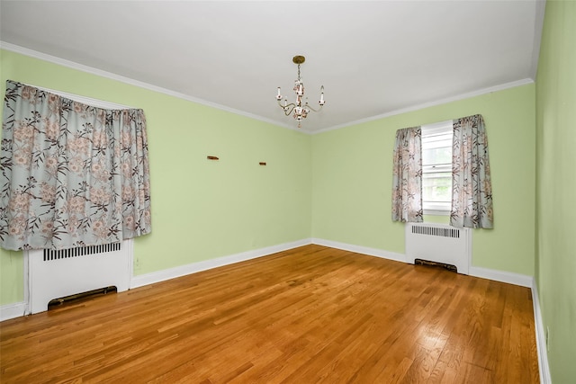 86-32 Avon St, Jamaica Estates, NY 11432 - unfurnished room with radiator, wood finished floors, a chandelier, ornamental molding, and baseboards