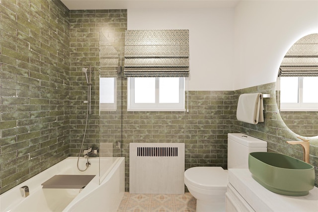 86-32 Avon St, Jamaica Estates, NY 11432 - full bathroom with radiator heating unit, tile walls, plenty of natural light, vanity, and toilet