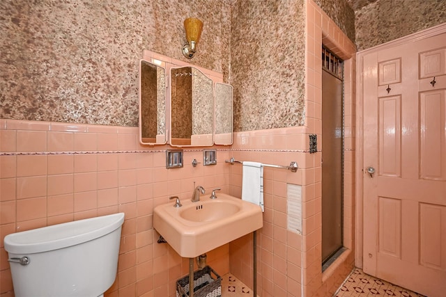 86-32 Avon St, Jamaica Estates, NY 11432 - full bathroom featuring wallpapered walls, a shower stall, toilet, a wainscoted wall, and tile walls
