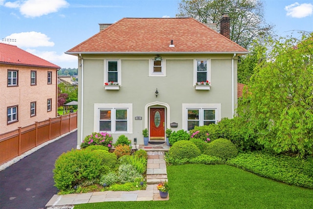 755 Webster Ave, New Rochelle, NY 10804 - view of front of house featuring stucco siding, a chimney, and a shingled roof