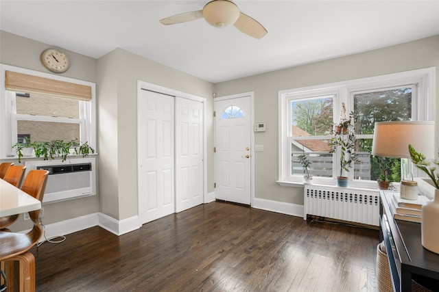 755 Webster Ave, New Rochelle, NY 10804 - entrance foyer with radiator, dark wood-type flooring, a ceiling fan, and baseboards