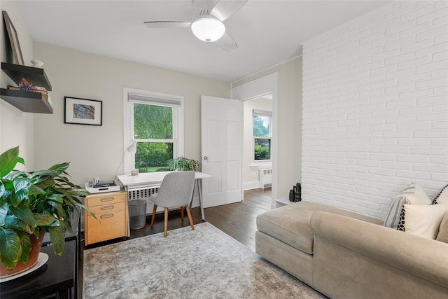 755 Webster Ave, New Rochelle, NY 10804 - office space featuring radiator heating unit, wood finished floors, ceiling fan, and brick wall