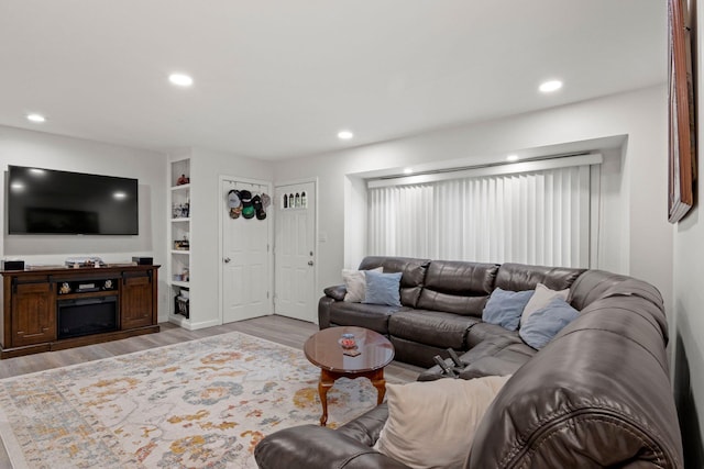 2287 7th St, East Meadow, NY 11554 - living room featuring light wood-style floors and recessed lighting