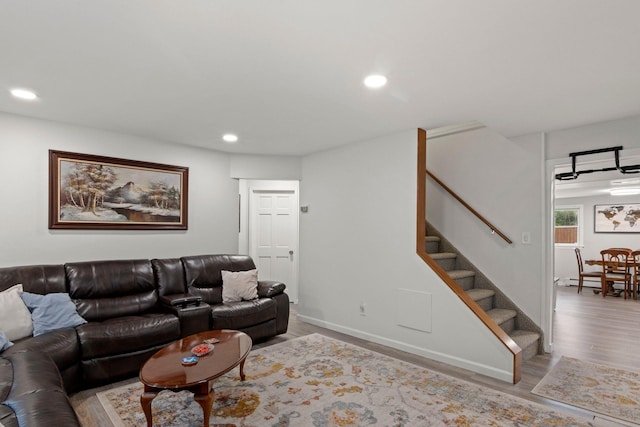 2287 7th St, East Meadow, NY 11554 - living room featuring stairway, wood finished floors, recessed lighting, and a baseboard radiator