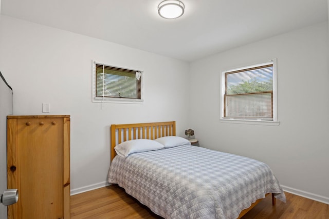 2287 7th St, East Meadow, NY 11554 - bedroom featuring baseboards and wood finished floors