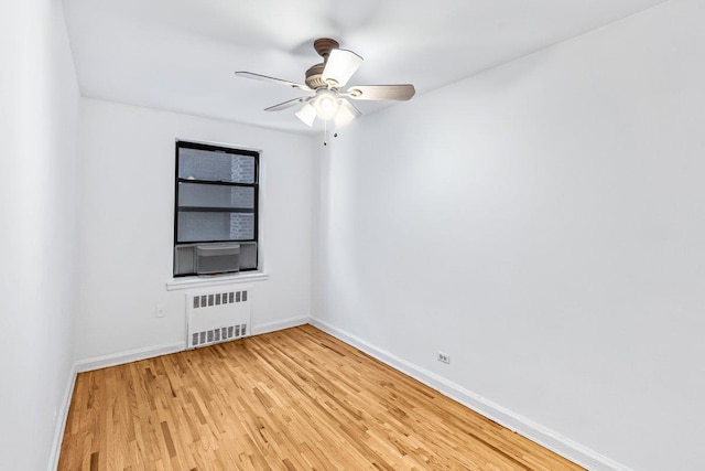 123-35 82nd Rd Unit 4H, Kew Gardens, NY 11415 - unfurnished room featuring radiator, baseboards, light wood-style flooring, and a ceiling fan
